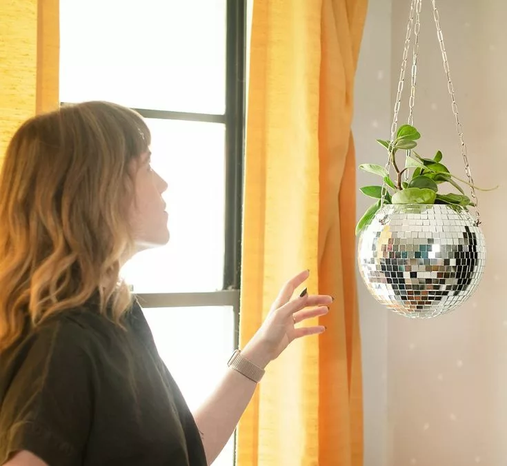 Step-by-step process for making a recycled disco ball planter